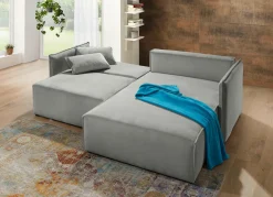 Polsterecke mit Bettfunktion und Hocker