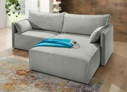 Polsterecke mit Bettfunktion und Hocker