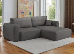 Polsterecke mit Bettfunktion und Dekokissen