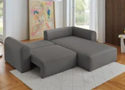Polsterecke mit Bettfunktion und Dekokissen