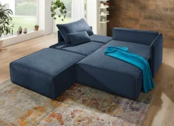Polsterecke mit Bettfunktion und Hocker